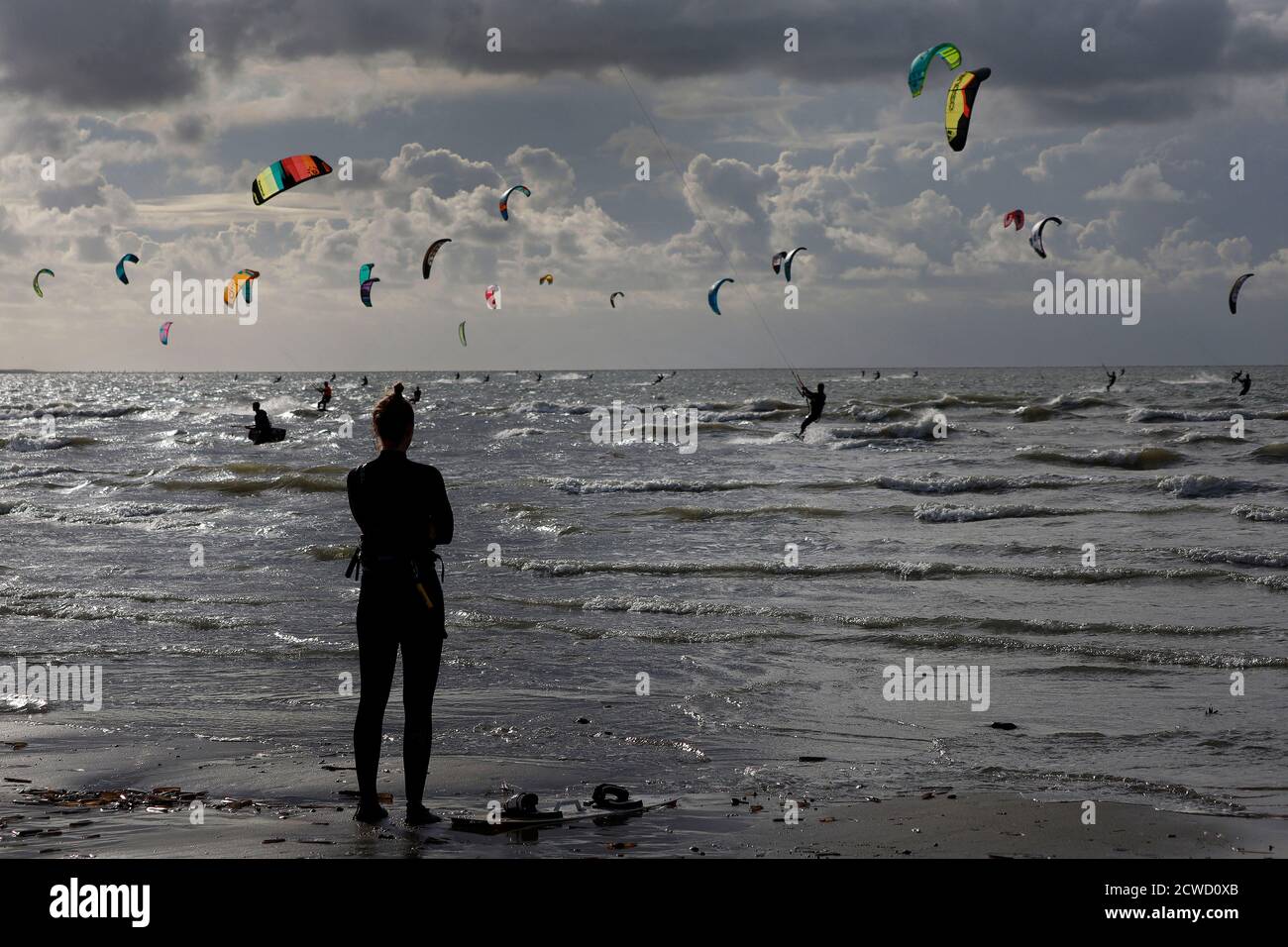 Netherlands, Kitesurfing,  26.09.2020 Kitesurfers  are surfing on the north sea near to the Brouwersdam  embankment in the Netherlands  Photo by Norbe Stock Photo