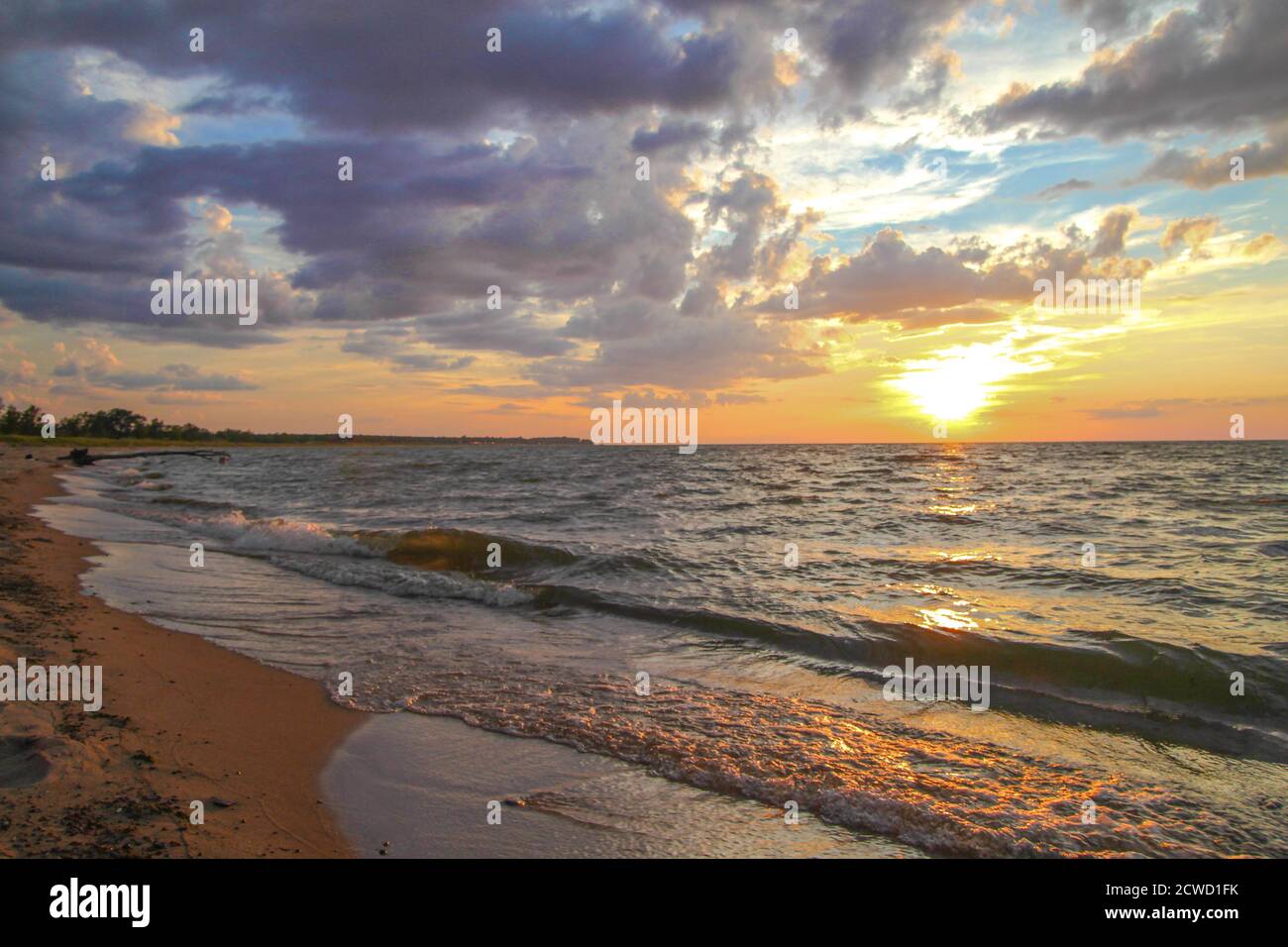 Beautiful Great Lakes sunrise beach over the horizon of the Lake Huron coast in Michigan, USA. Stock Photo