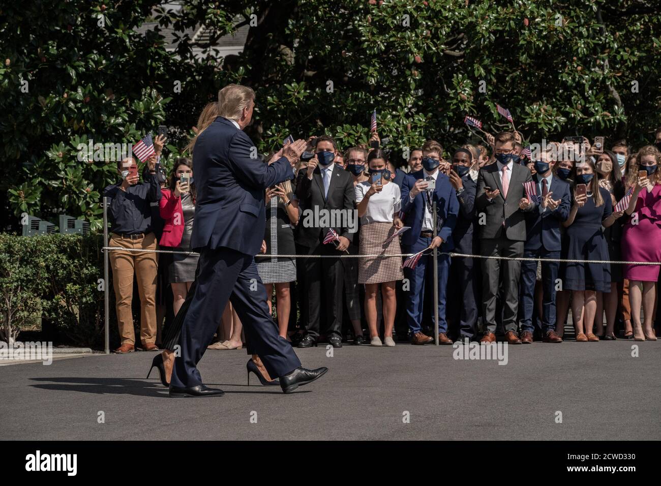 United States President Donald J. Trump and First lady Melania Trump wave to supporters as they walk across the South Lawn to Marine One at the White House in Washington, DC on Monday, September 28, 2020. Trump is traveling to participate in the First Presidential Debate against former Vice President Joe Biden in Cleveland, Ohio.Credit: Ken Cedeno/Pool via CNP /MediaPunch Stock Photo