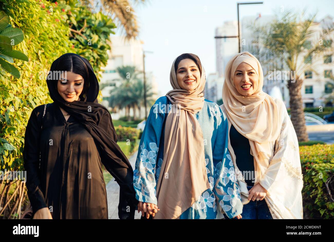 Three women friends going out in Dubai. Girls wearing the united arab emirates traditional abaya
