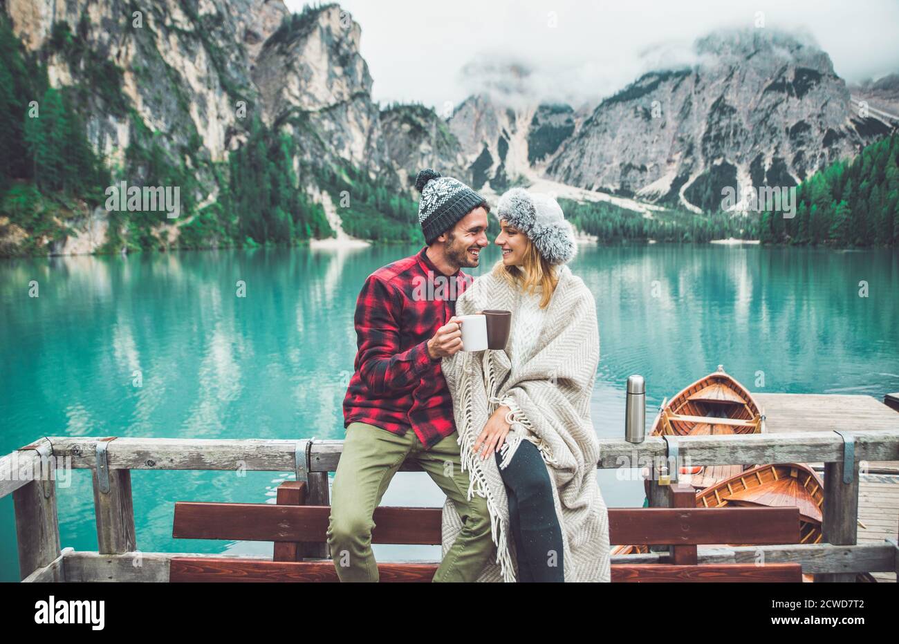 Mountain stories. Happy couple on a wanderlust vacation. Boyfriend and girlfriend spending time together at the lake. Storytelling concept about lifes Stock Photo