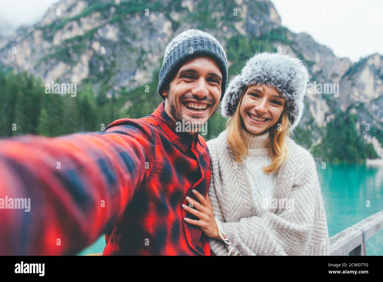 Mountain stories. Happy couple on a wanderlust vacation. Boyfriend and girlfriend spending time together at the lake. Storytelling concept about lifes Stock Photo