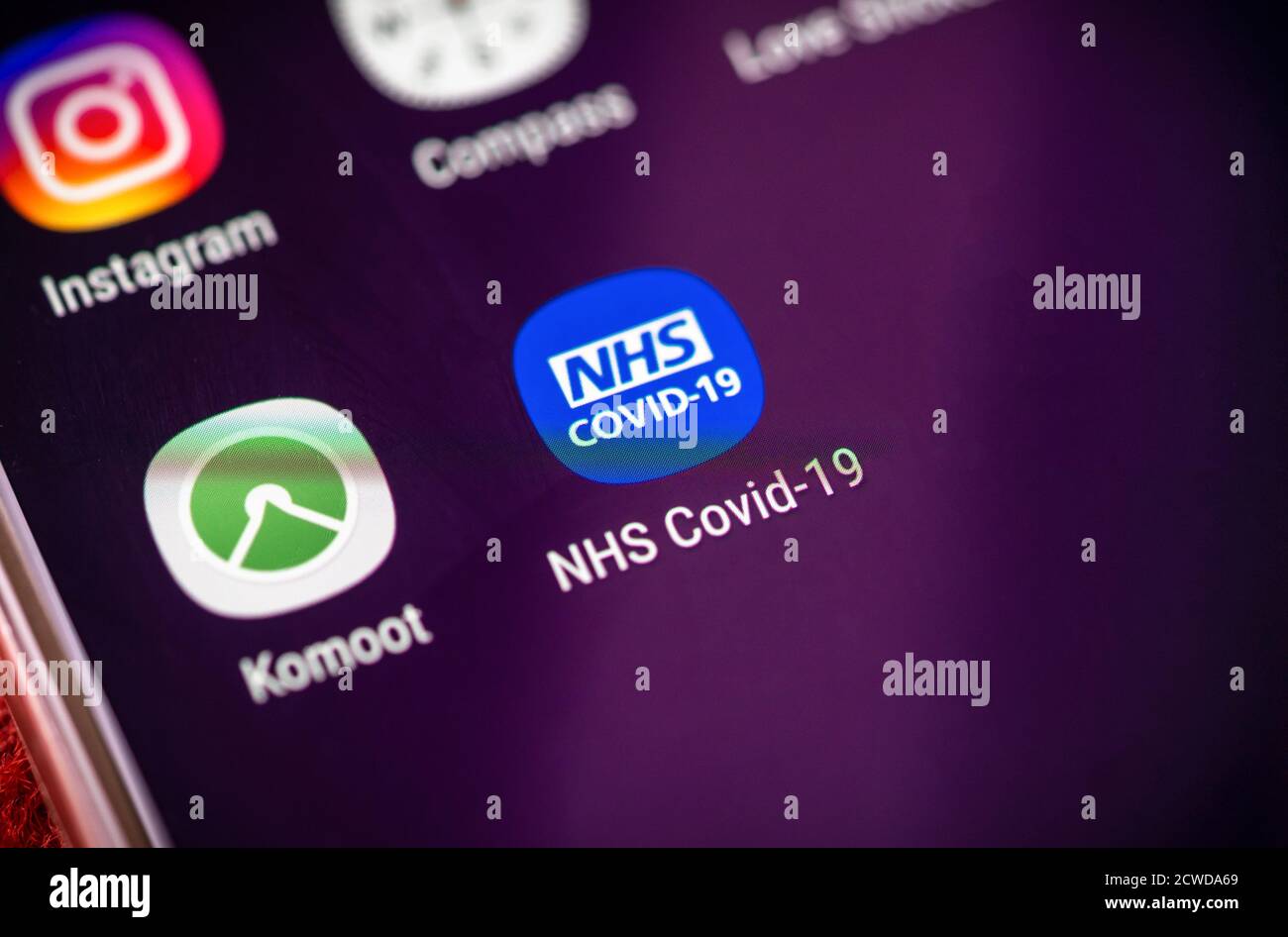 NHS Covid-19 app icon on a mobile phone screen display, the app launched on 24 September 2020 to be used as a contact tracing app in England and Wales, UK Stock Photo