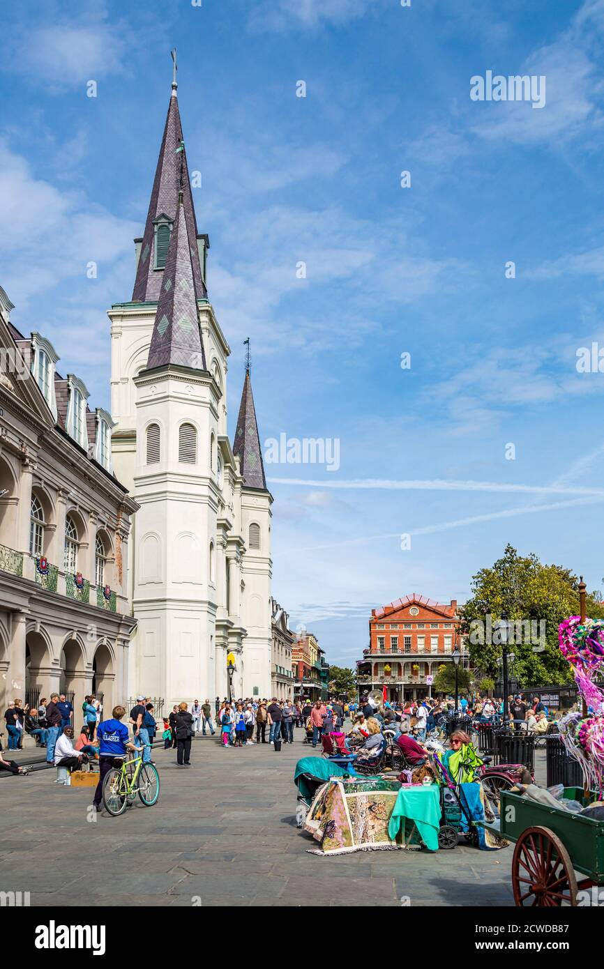 Tourists gather at the front of the St. Louis Cathedral at Jackson Square in the French Quarter of New Orleans, Louisiana, USA Stock Photo