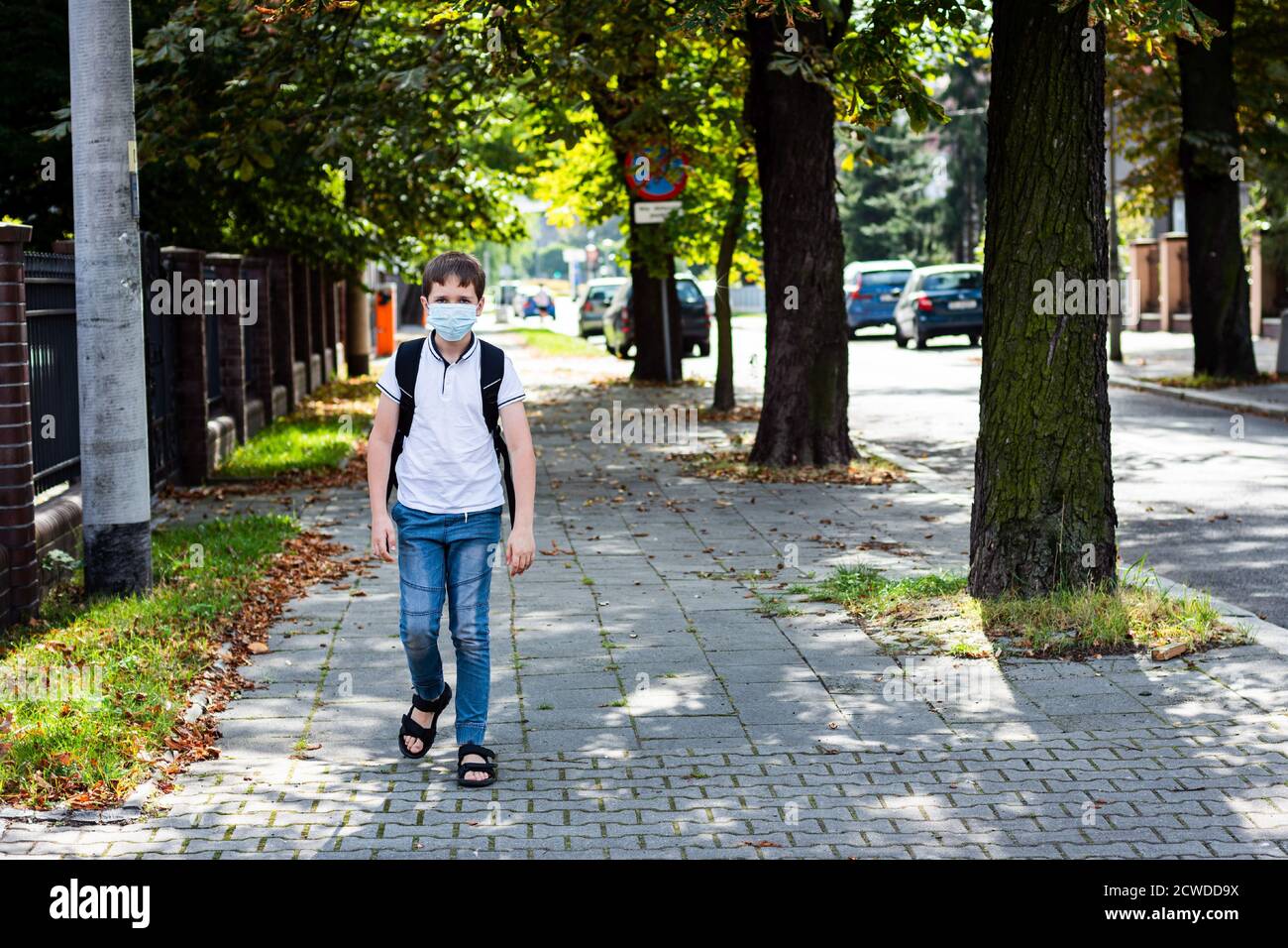 Boy in mask going to school in medical mask Stock Photo Alamy