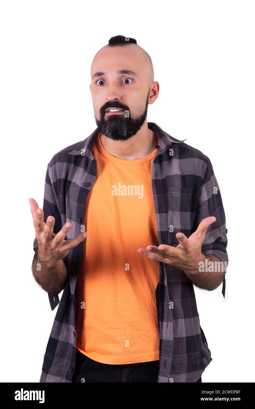 Expectant young hispanic man hoping for a change Stock Photo