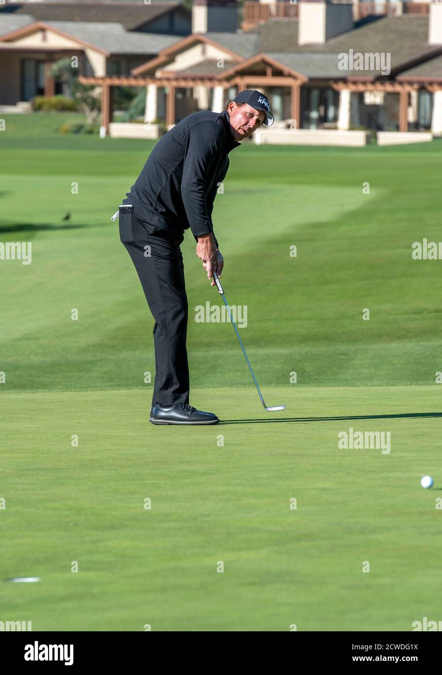 Pebble Beach, Carmel, California, USA. 9th Feb, 2020. Phil Mickelson putts on the 1st hole green during the championship round of the AT&T Pro-Am on Sunday Credit: Action Plus Sports/Alamy Live News Stock Photo