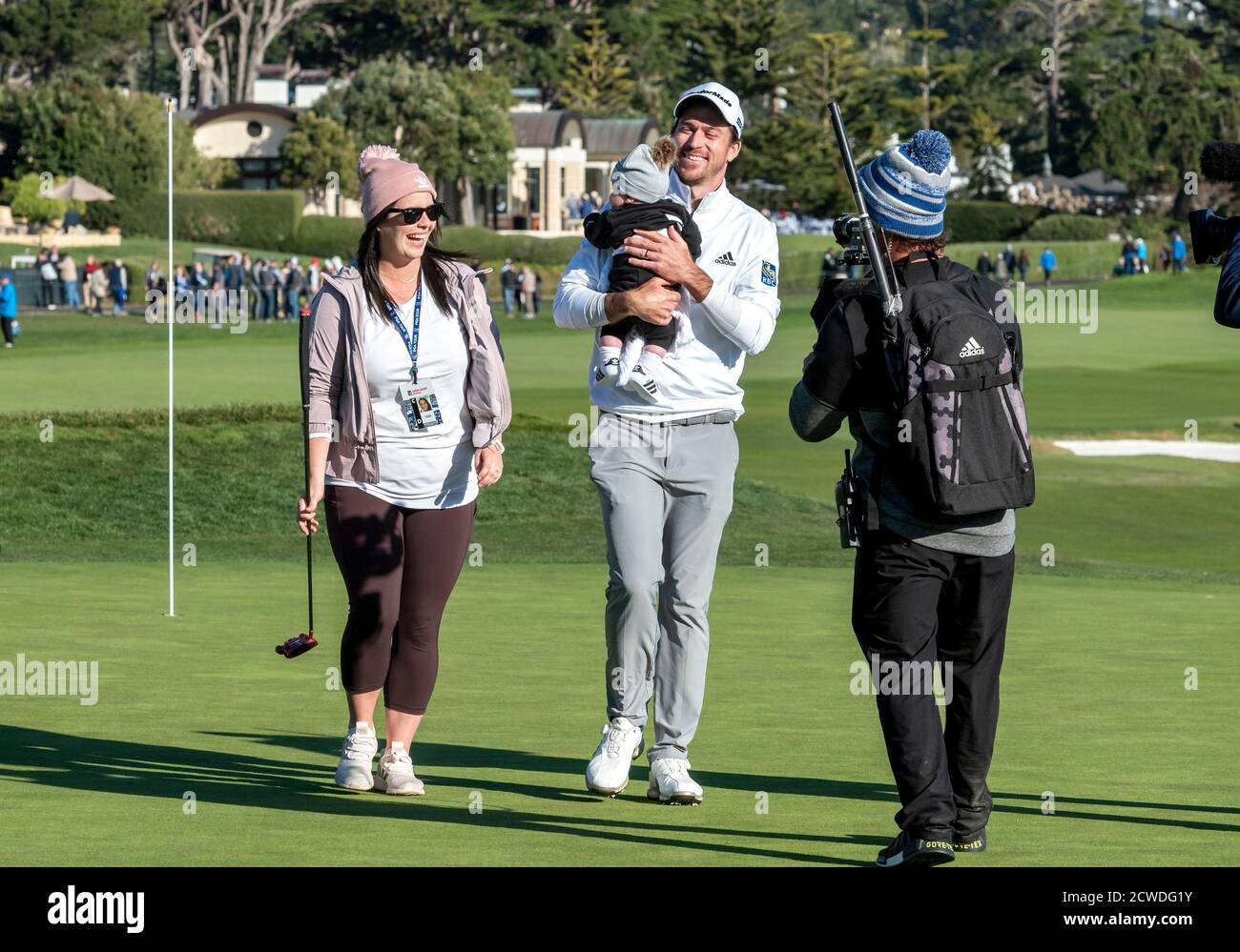 Pebble Beach, Carmel, California, USA. 9th Feb, 2020. Nick Taylor and his family celebrate on the 18th green after winning the championship round of the AT&T Pro-Am on Sunday Credit: Action Plus Sports/Alamy Live News Stock Photo