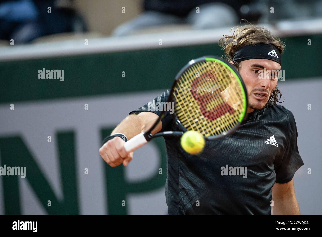 Paris, France. 29th Sep, 2020. Stefanos Tsitsipas returns the ball during the men's singles first round match between Stefanos Tsitsipas of Greece and Jaume Munar of Spain in the French Open tennis tournament 2020 at Roland Garros in Paris, France, Sept. 29, 2020. Credit: Aurelien Morissard/Xinhua/Alamy Live News Stock Photo