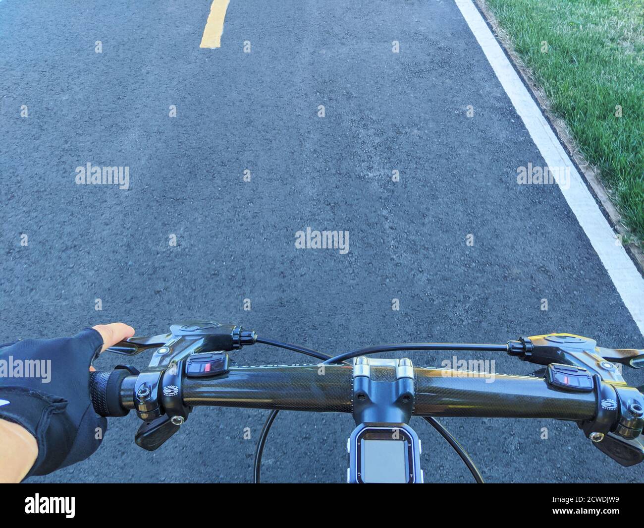 riding on the handlebars of a bike