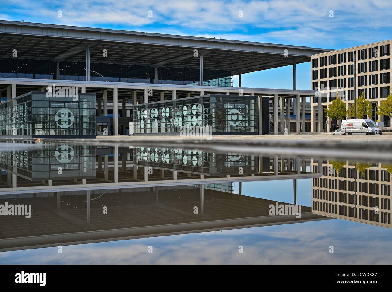 29 September 2020, Brandenburg, Schönefeld: The main terminal of Berlin Brandenburg Airport 'Willy Brandt' (BER) is reflected in the water of a fountain. The capital city airport BER on the border to Berlin is scheduled to open on 31.10.2020. Photo: Patrick Pleul/dpa-Zentralbild/dpa Stock Photo
