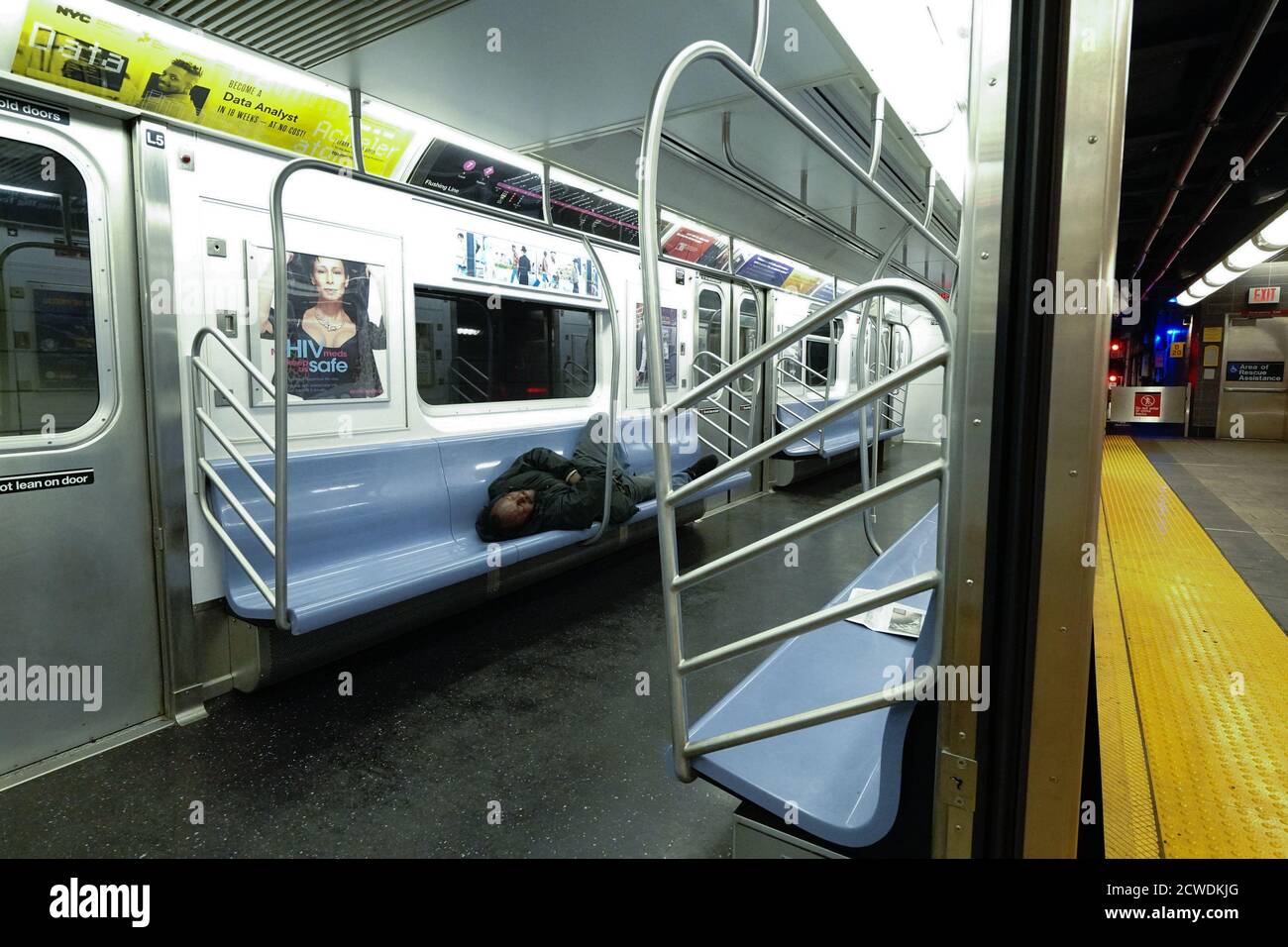 A homeless person sleeping on a subway train in Hudson Yards, New York ...