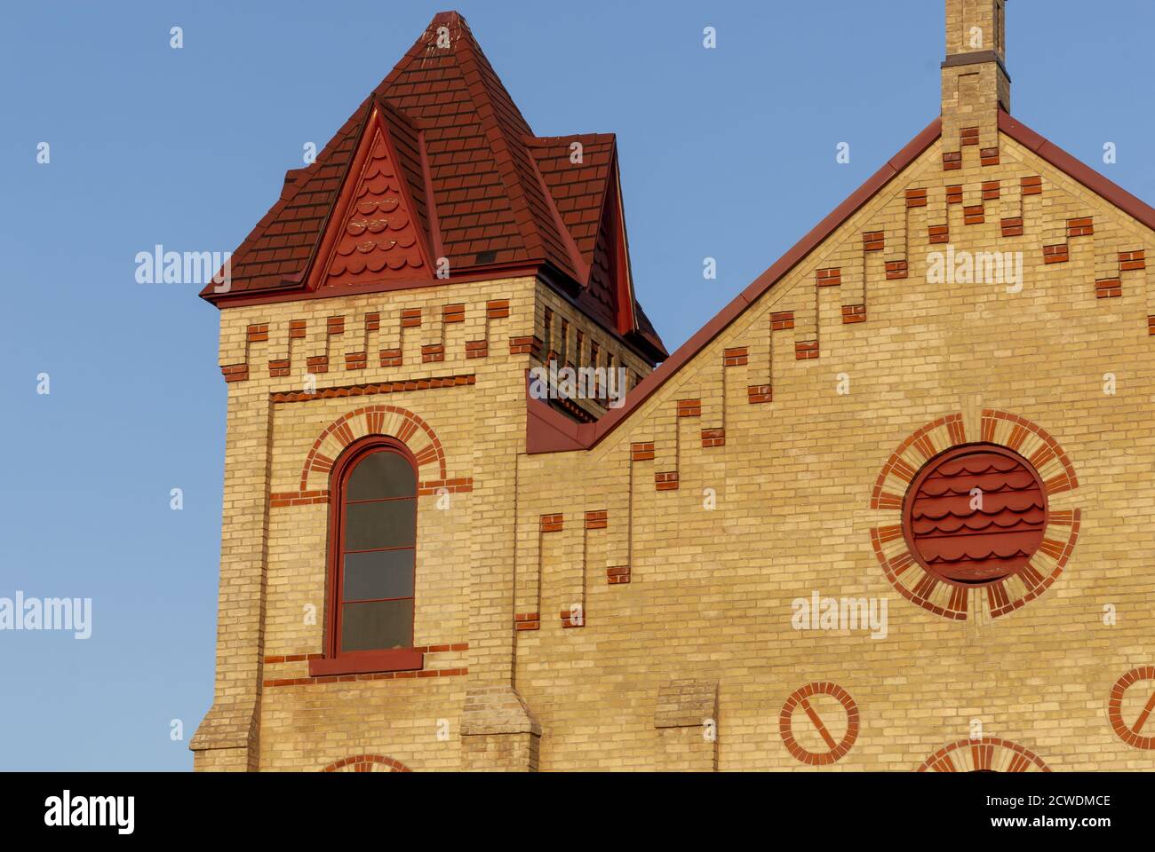 View of a brick wall church against the blue sky Stock Photo - Alamy
