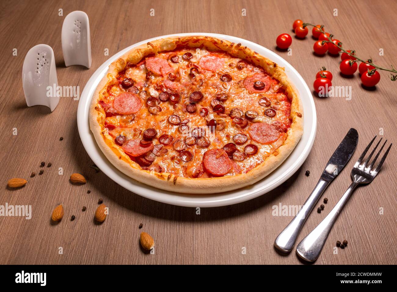 Pizza is super meat thin cake, tomato sauce, beef balyk, ham, bacon, hunting Stock Photo