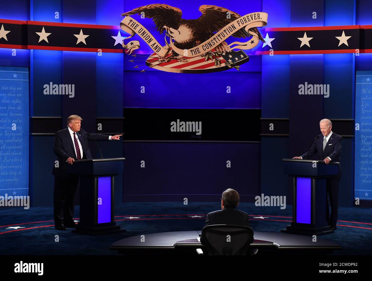 Cleveland, United States. 29th Sep, 2020. President Donald Trump (L) and Democratic presidential nominee Joe Biden (R), with Chris Wallace moderating, face off in the first of three scheduled 90 minute presidential debates, in Cleveland, Ohio, on Tuesday, September 29, 2020. Photo by Kevin Dietsch/UPI Credit: UPI/Alamy Live News Stock Photo