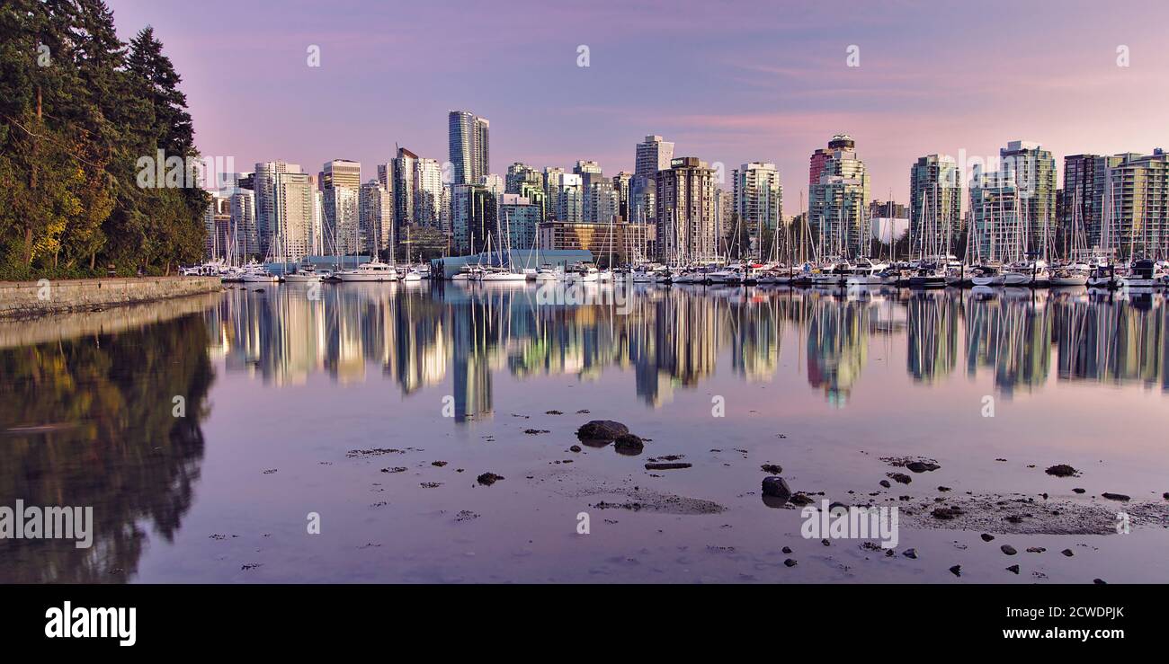 Panoramic view of Downtown Vancouver during sunset from Stanley Park sea wall, Vancouver, British Columbia, Canada Stock Photo