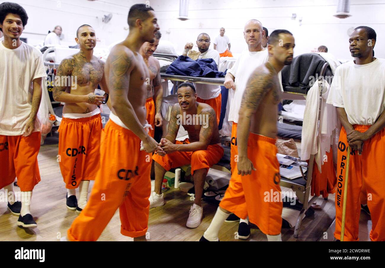Inmates walk around a gymnasium where they are housed due to overcrowding at the California Institution for Men state prison in Chino, California, June 3, 2011. The Supreme Court has ordered California to release more than 30,000 inmates over the next two years or take other steps to ease overcrowding in its prisons to prevent 'needless suffering and death.' California's 33 adult prisons were designed to hold about 80,000 inmates and now have about 145,000. The United States has more than 2 million people in state and local prisons. It has long had the highest incarceration rate in the world.  Stock Photo