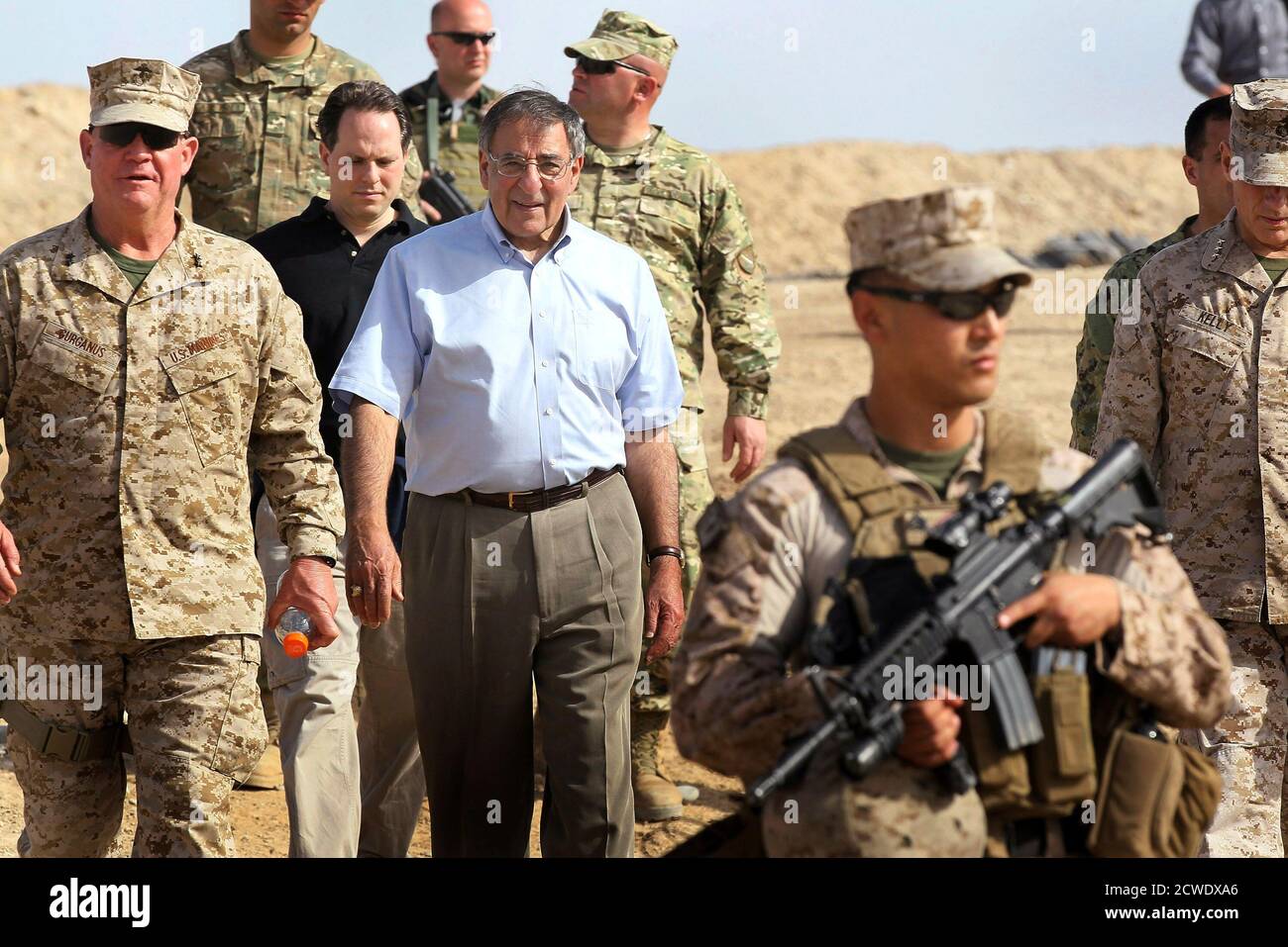 U.S. Secretary of Defense Leon Panetta (C) leaves after visiting with troops from the 31st BN Light Infantry of the Georgian Army at Forward Operating Base Shukvani, March 14, 2012. Panetta told troops in Afghanistan on Wednesday that the massacre of 16 Afghan civilians by an American soldier should not deter them from their mission to secure the country ahead of a 2014 NATO withdrawal deadline.  REUTERS/Scott Olson/Pool (AFGHANISTAN - Tags: POLITICS MILITARY) Stock Photo