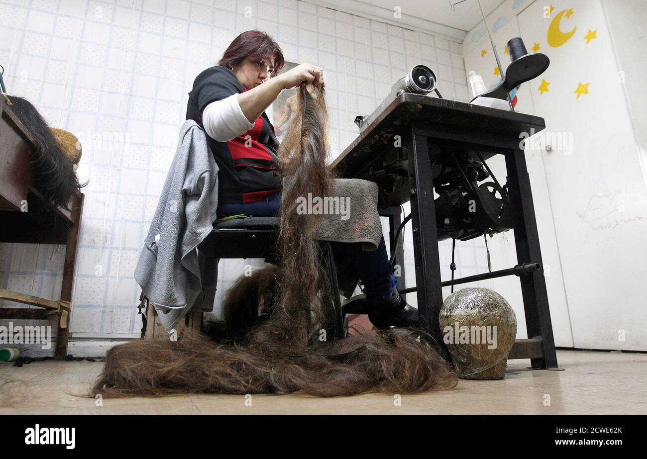 Marcela Reyes Makes A Natural Hair Wig To Be Donated To A Girl Undergoing Chemotherapy For Cancer In Santiago August 22 2014 The Wigs Handmade By Italian Chilean Hair Stylist Marcelo Avatte And