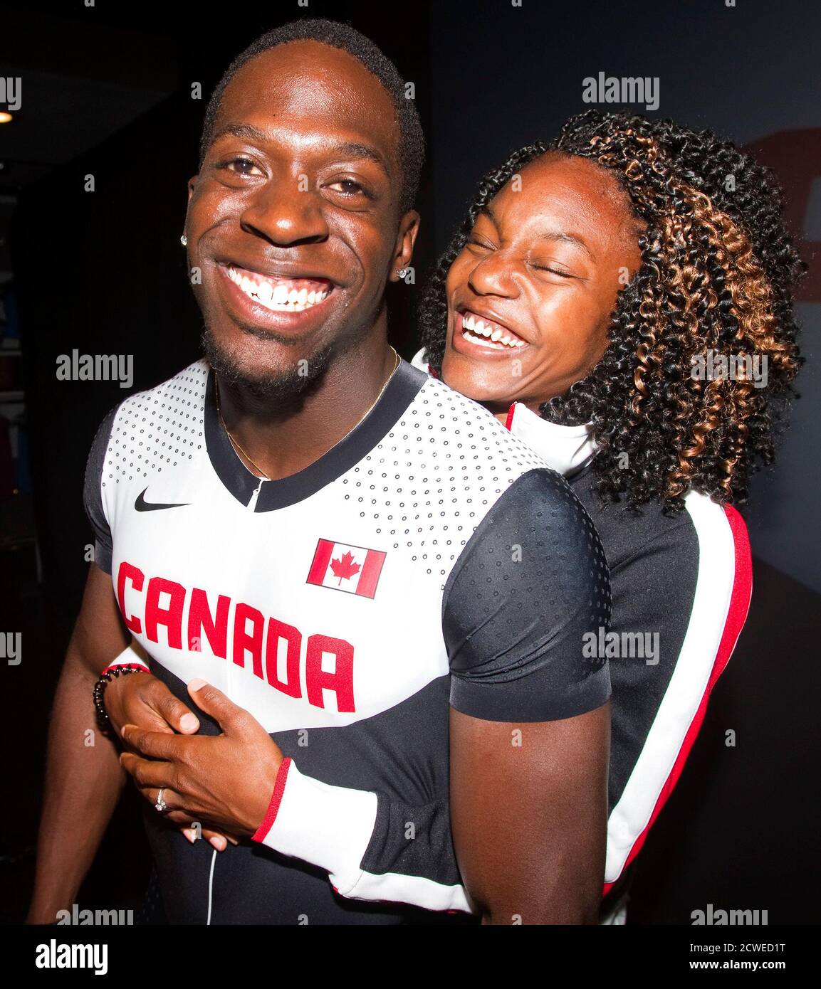 Canadian Olympic athlete Justyn Warner and his fiancee Olympic athlete  Nikkita Holder (R) are pictured at a press conference held by Nike and  Athletics Canada to unveil Canadian Olympic team apparel in