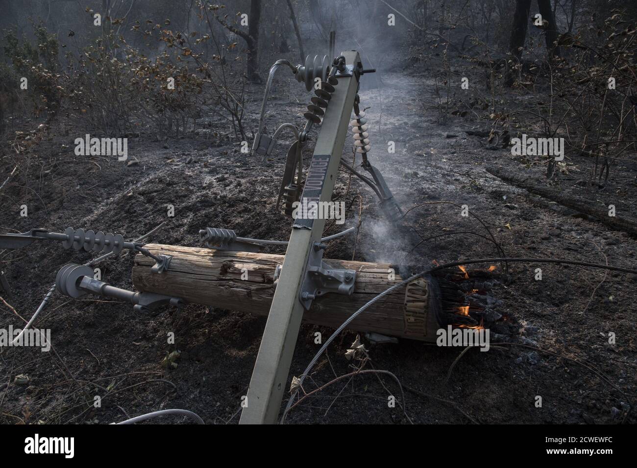 Angwin, United States. 29th Sep, 2020. A burning high volltage power pole lies beside the road in Angwin, California on Tuesday, September 29, 2020. The Glass Fire has burned over 40,000 acres and is only 2% contained. Photo by Terry Schmitt/UPI Credit: UPI/Alamy Live News Stock Photo