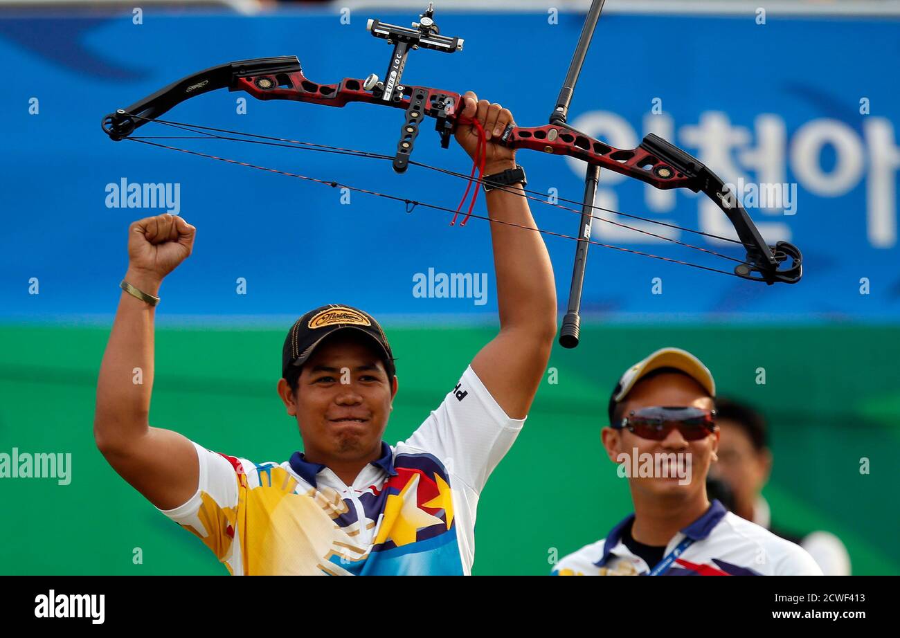 Paul Marton Dela Cruz Of The Philippines Celebrates Winning His Men S Compound Individual Bronze Medal Archery Match Against Malaysia S Muhammad Zaki Bin Mahazan At The Gyeyang Asiad Archery Field During The 2014