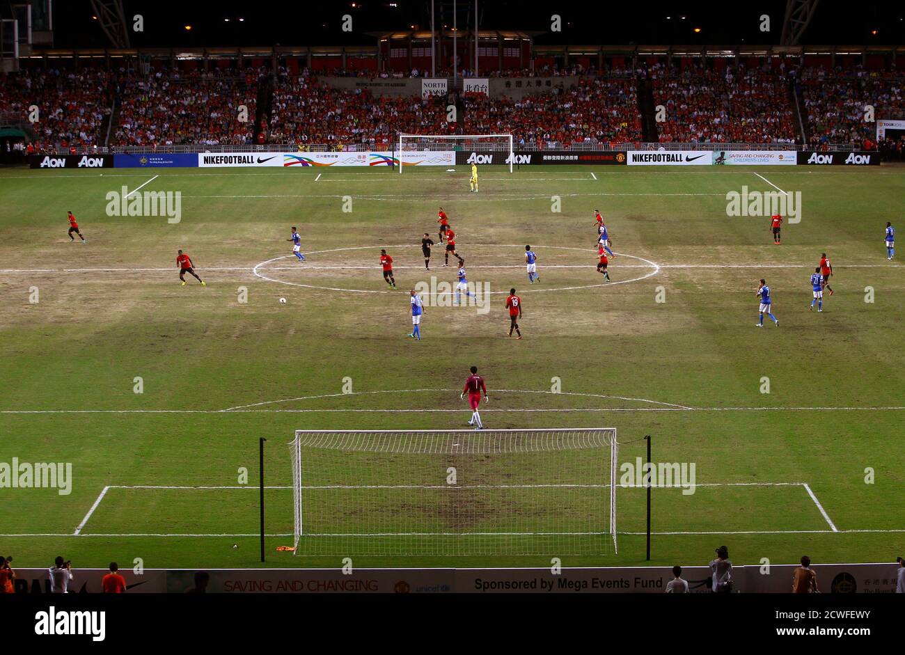 Visiting English Premier League Manchester United (red) and local team  Kitchee play on a partly sandy ground during their friendly match at Hong  Kong Stadium in Hong Kong July 29, 2013. Manchester