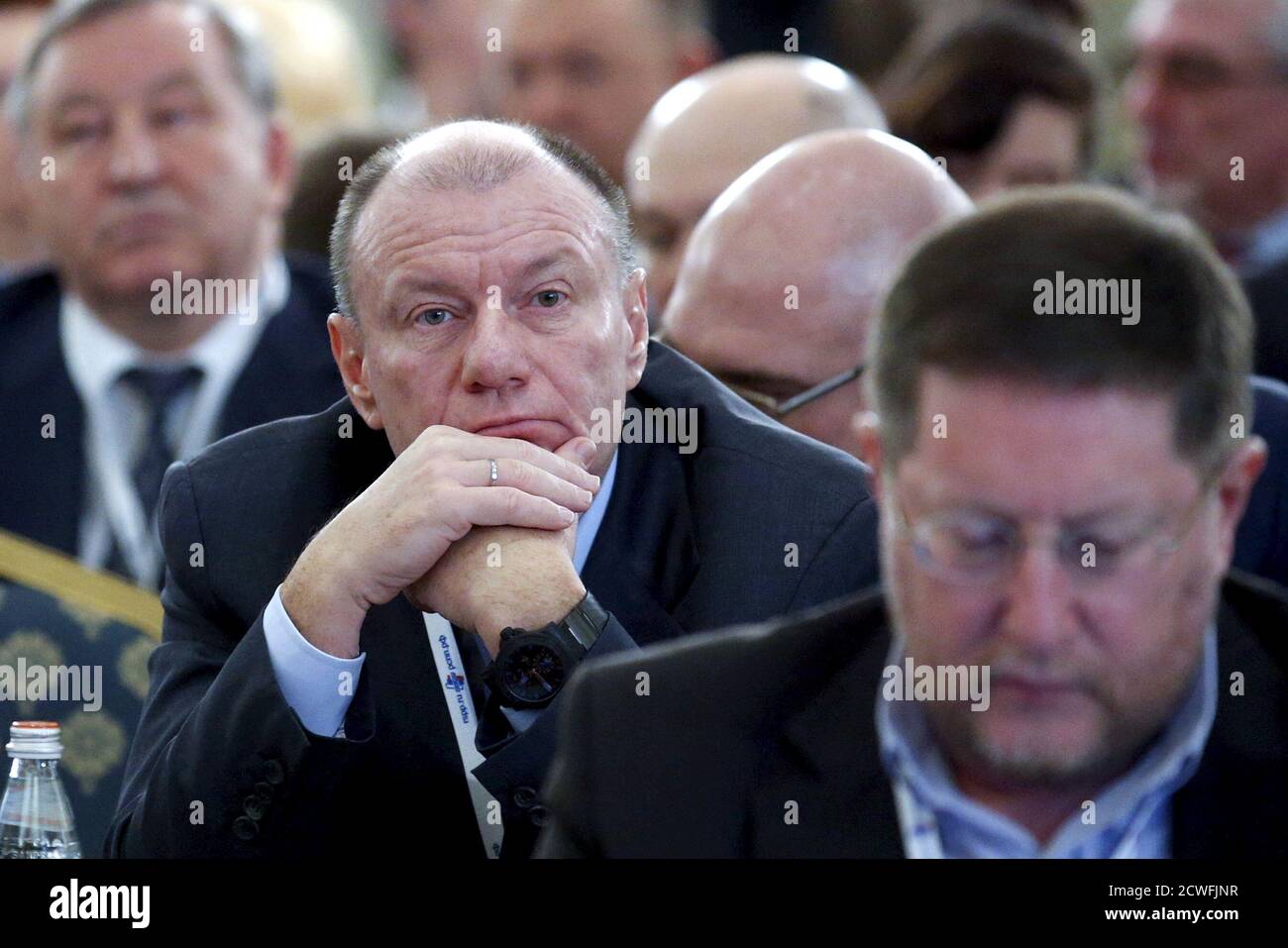 Vladimir Potanin (L, front), chief executive of Norilsk Nickel company and Russia's richest man, attends a session during the Week of Russian Business, organized by the Russian Union of Industrialists and Entrepreneurs (RSPP), in Moscow, March 19, 2015. Russia's Norilsk Nickel , the world's second largest nickel and largest palladium producer, is considering a buy-back of its shares to support its stock, Interfax news agency quoted Vladimir Potanin, its chief executive, as saying on Thursday. REUTERS/Maxim Zmeyev Stock Photo