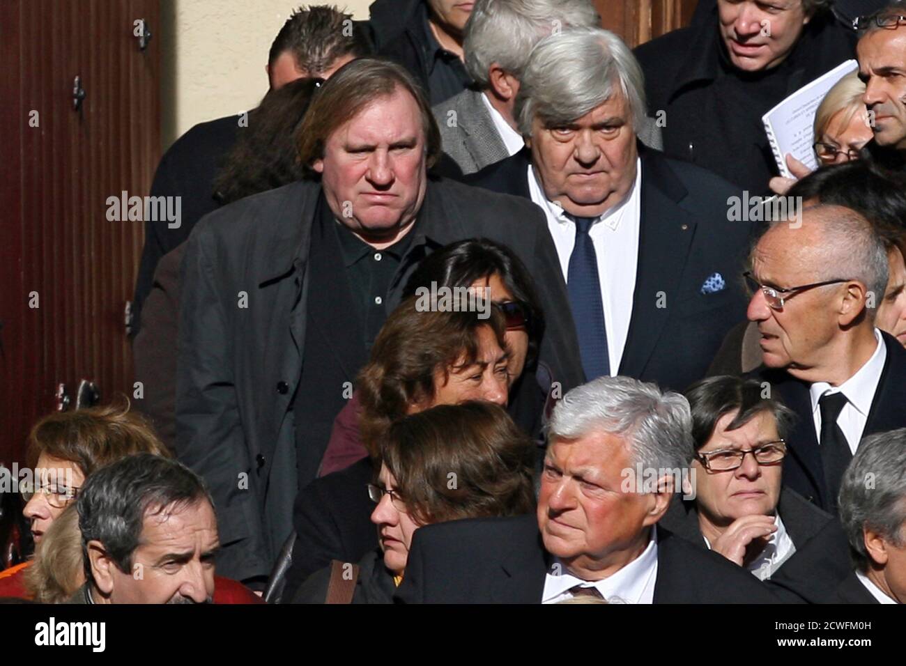French actor Gerard Depardieu (L) and Louis Nicollin, president of the  Montpellier Football Club, leave funeral services for Georges Freche,  French politician and president of the Regional Council of  Languedoc-Roussillon, at the