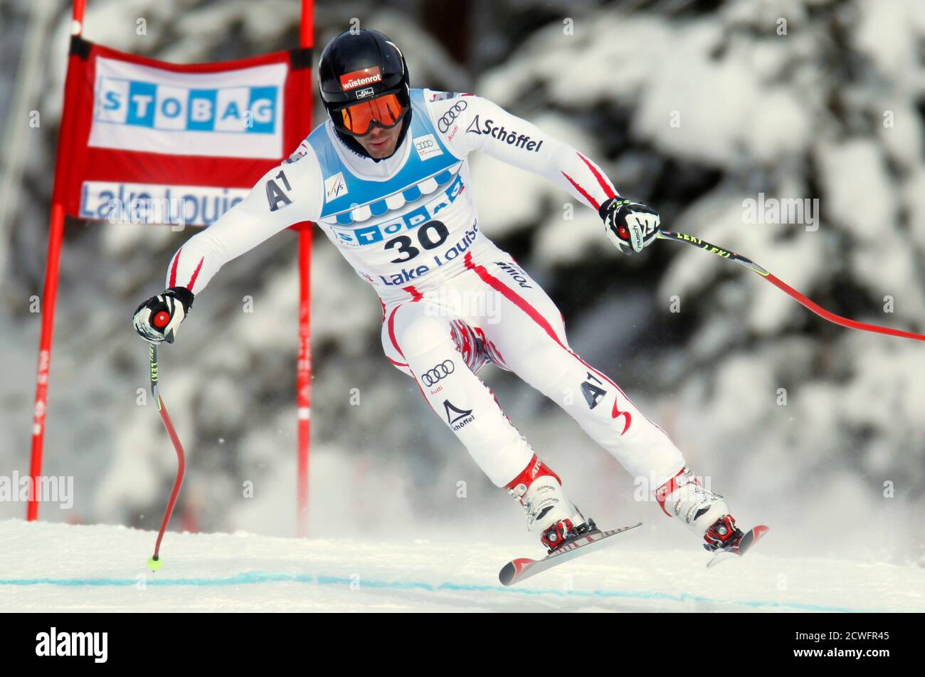 Joachim Puchner of Austria makes a turn during alpine skiing training for the Men's World Cup Downhill in Lake Louise, Alberta November 24, 2011.    REUTERS/Mike Blake     (CANADA - Tags: SPORT SKIING) Stock Photo