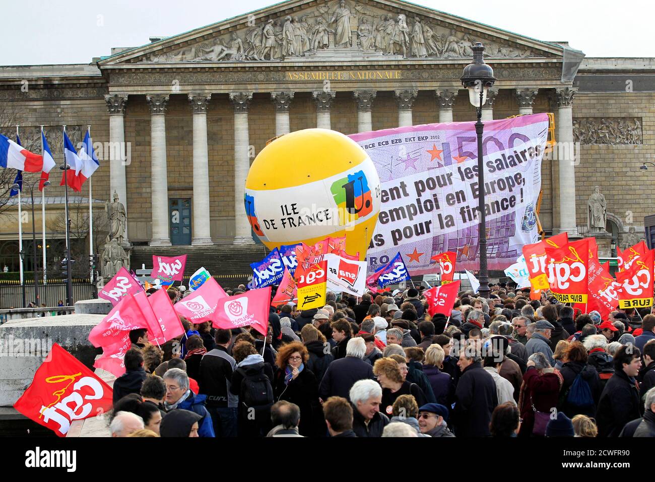Private and public sector workers take part in a demonstration to protest against austerity measures in front the National Assembly in Paris December 13, 2011. Trade unions organised anti-austerity protests across France on Tuesday but admitted that mobilising support was tough in a country less severely hit by the euro zone crisis than the likes of Greece or Ireland. REUTERS/Charles Platiau (FRANCE - Tags: POLITICS BUSINESS EMPLOYMENT) Stock Photo