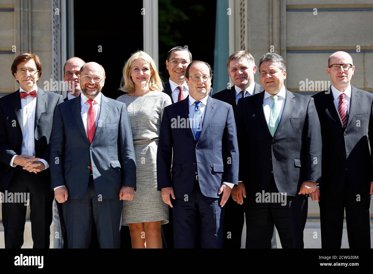French President Francois Hollande (C) poses with, from the (L-R), Belgium Prime Minister Elio Di Rupo, Dutch Labour Party (PvdA) leader Diederik Samsom, EU Parliament President Martin Schulz, Denmark Prime Minister Helle Thorning-Schmidt, Romania Prime Minister Victor Viorel Ponta, French President Francois Hollande, Slovakia Prime Minister Robert Fico, German Economy Minister Sigmar Gabriel, and Czech Republic Prime Minister Bohuslav Sobotka for photographers at the Hotel de Marigny at an informal meeting of European Social-Democrat leaders in Paris June 21, 2014. The meeting is to seek a co Stock Photo