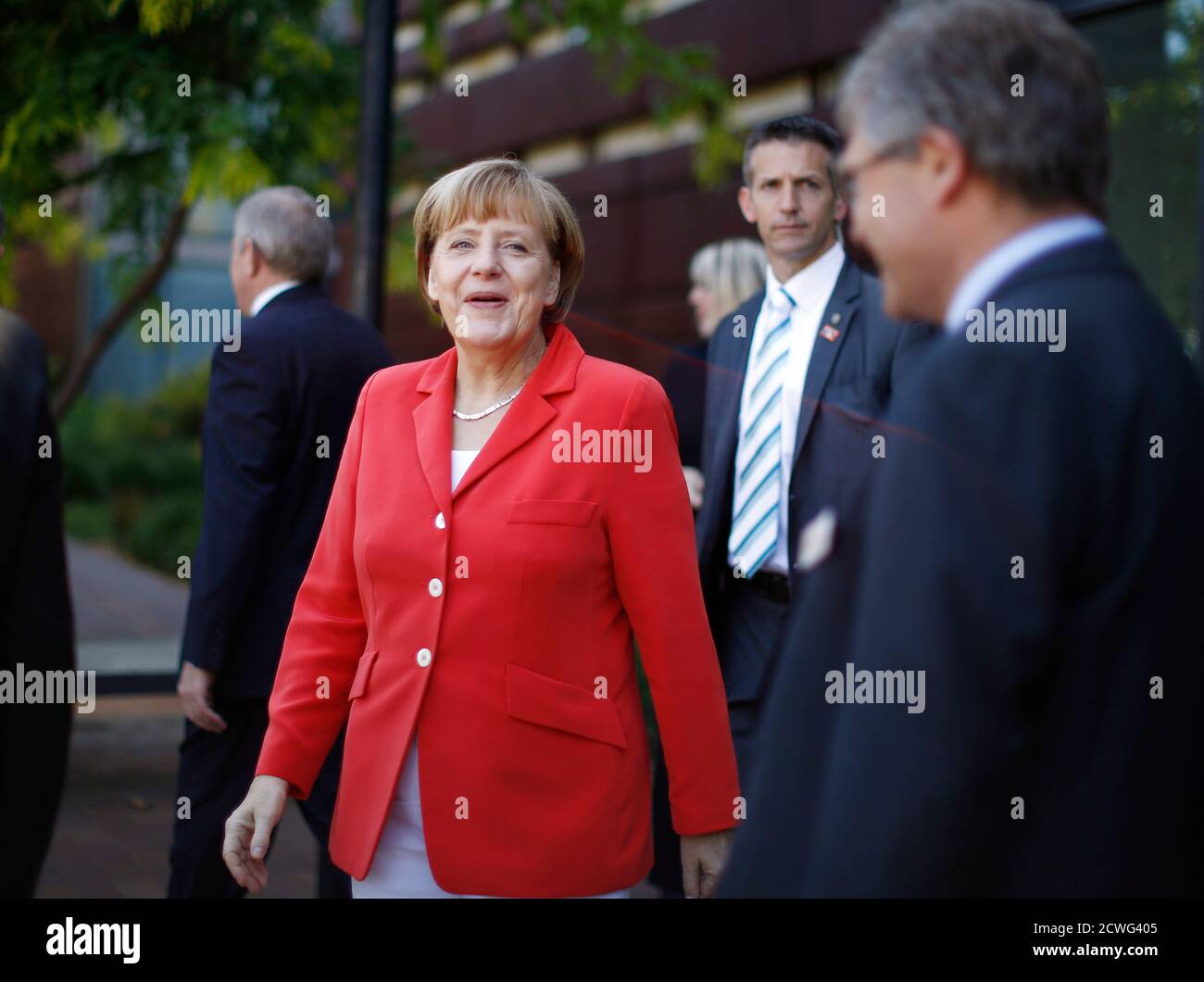 Germany's Chancellor Angela Merkel walks from her visit to the Future Logistics Living Lab in Sydney, November 17, 2014. Merkel is in Sydney following the G20 leaders Summit in Brisbane.     REUTERS/Jason Reed    (AUSTRALIA - Tags: POLITICS SCIENCE TECHNOLOGY) Stock Photo