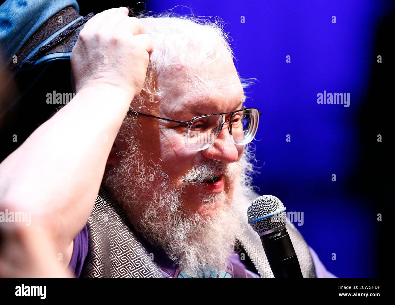 George R.R. Martin, author of the "Song of Ice and Fire" fantasy series  that is the basis of the television series "Game of Thrones", gestures  during his masterclass at the Neuchatel International