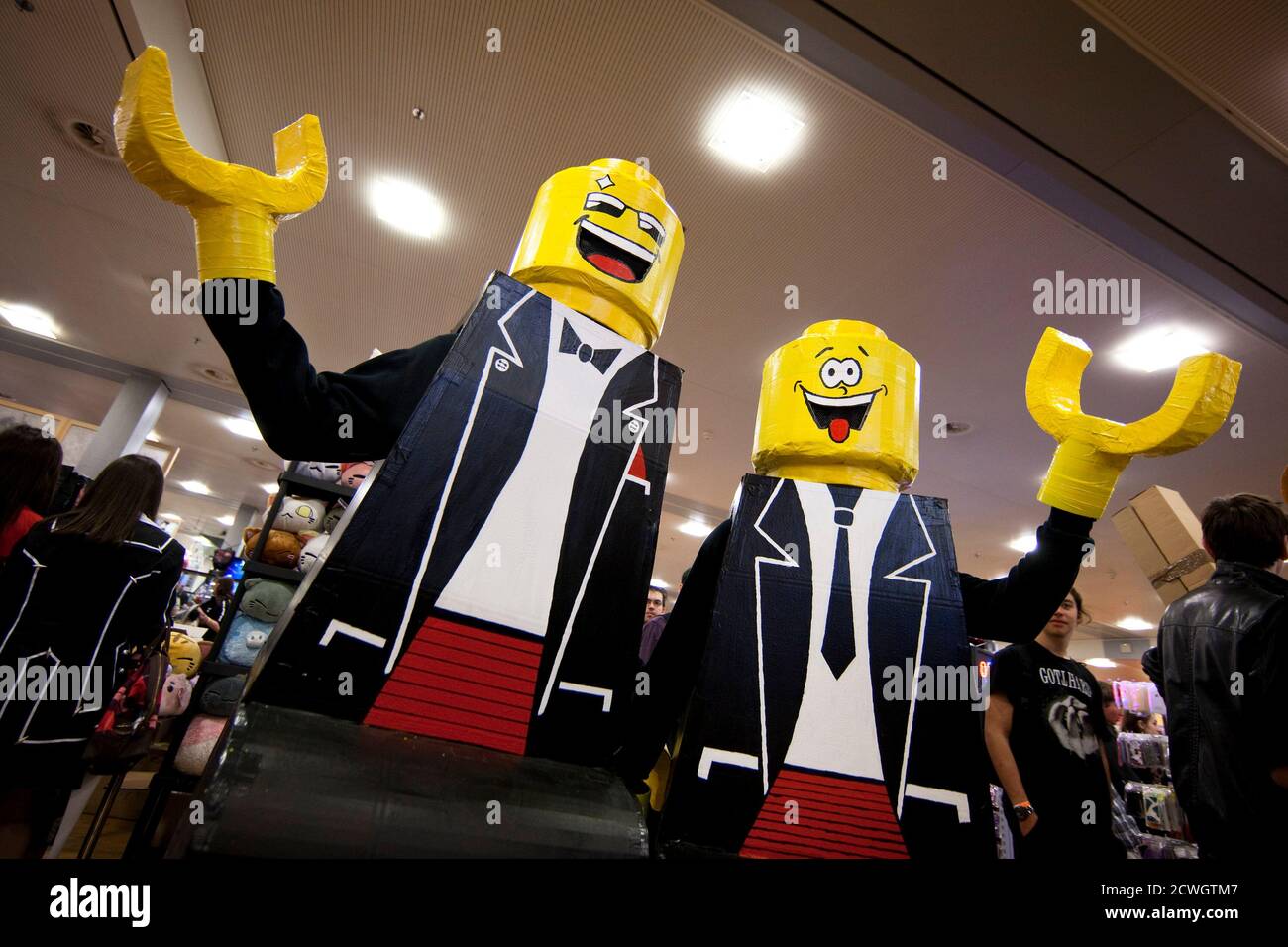 Visitors wearing Lego toy costumes pose at the Polymanga show in Lausanne,  April 7, 2012. Polymanga is the largest manga, anime, video games and pop  culture convention in Switzerland gathering over 16,000