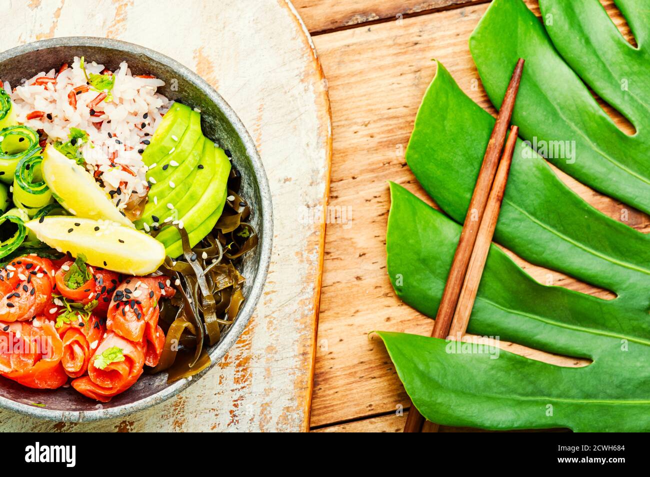 Hawaiian salmon poke bowl with rice,seaweed and avocado Stock Photo Alamy