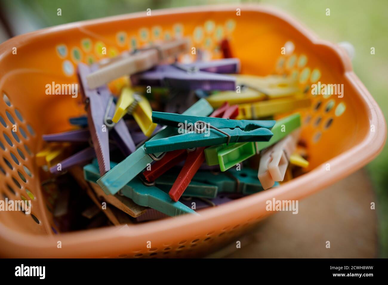 Details with a stack of plastic clothes pegs Stock Photo