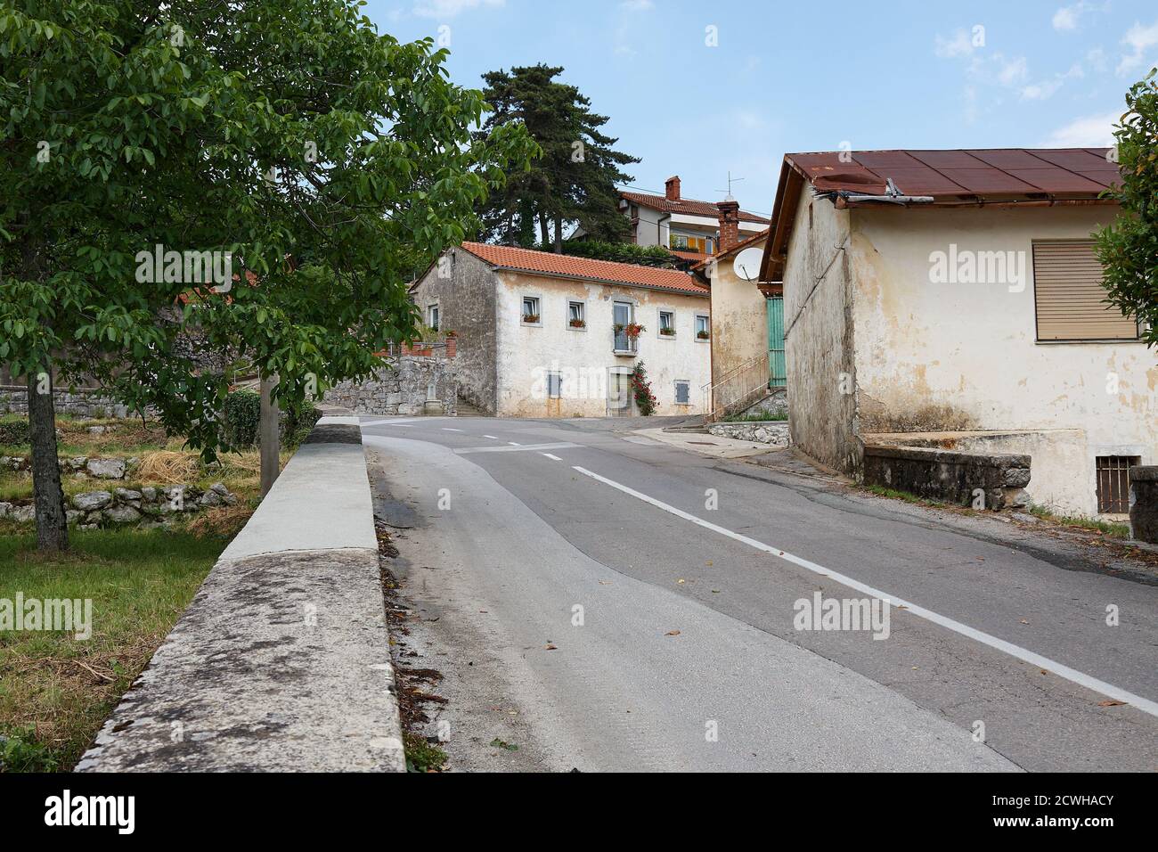 Road in Croatia through a village Stock Photo