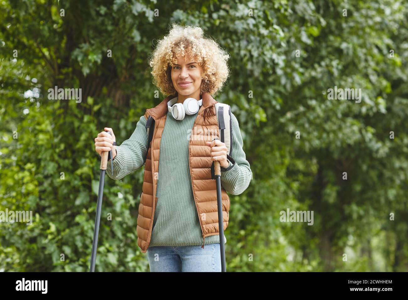 Young healthy woman walking outdoors in the forest Stock Photo