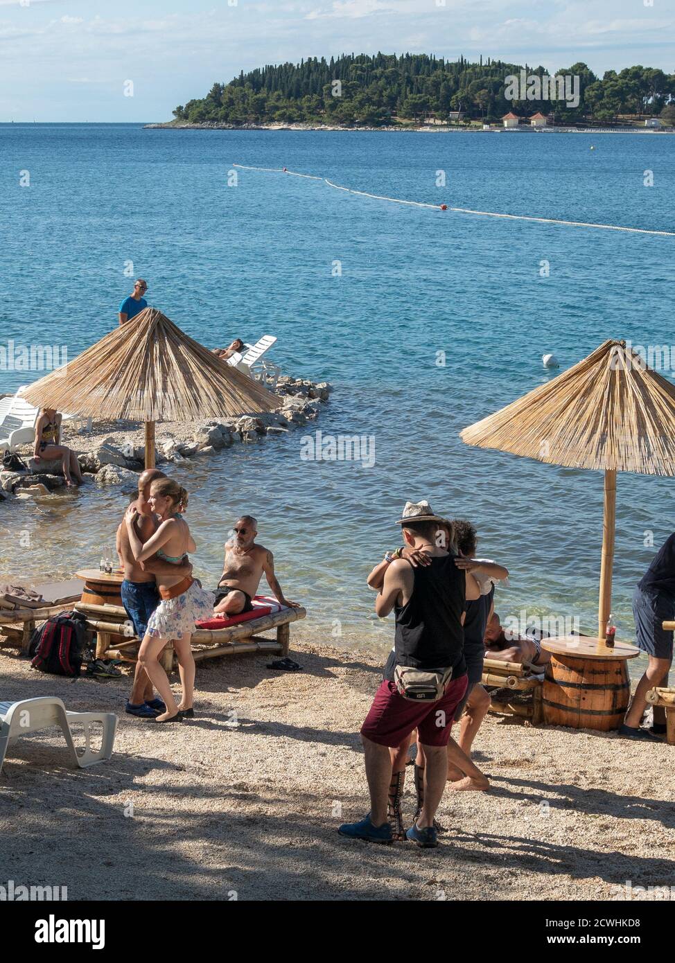 ROVINJ, CROATIA - 06/22/2018: Croatian Summer Salsa Festival 2018. Dancig couples on the beach. Stock Photo