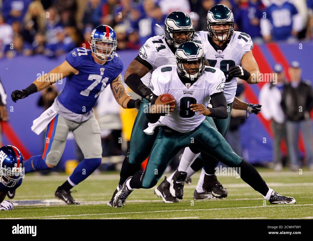 Philadelphia Eagles quarterback Vince Young (8) runs downfield in the first  quarter of their NFL football game against the New York Giants in East  Rutherford, New Jersey, November 20, 2011. At left