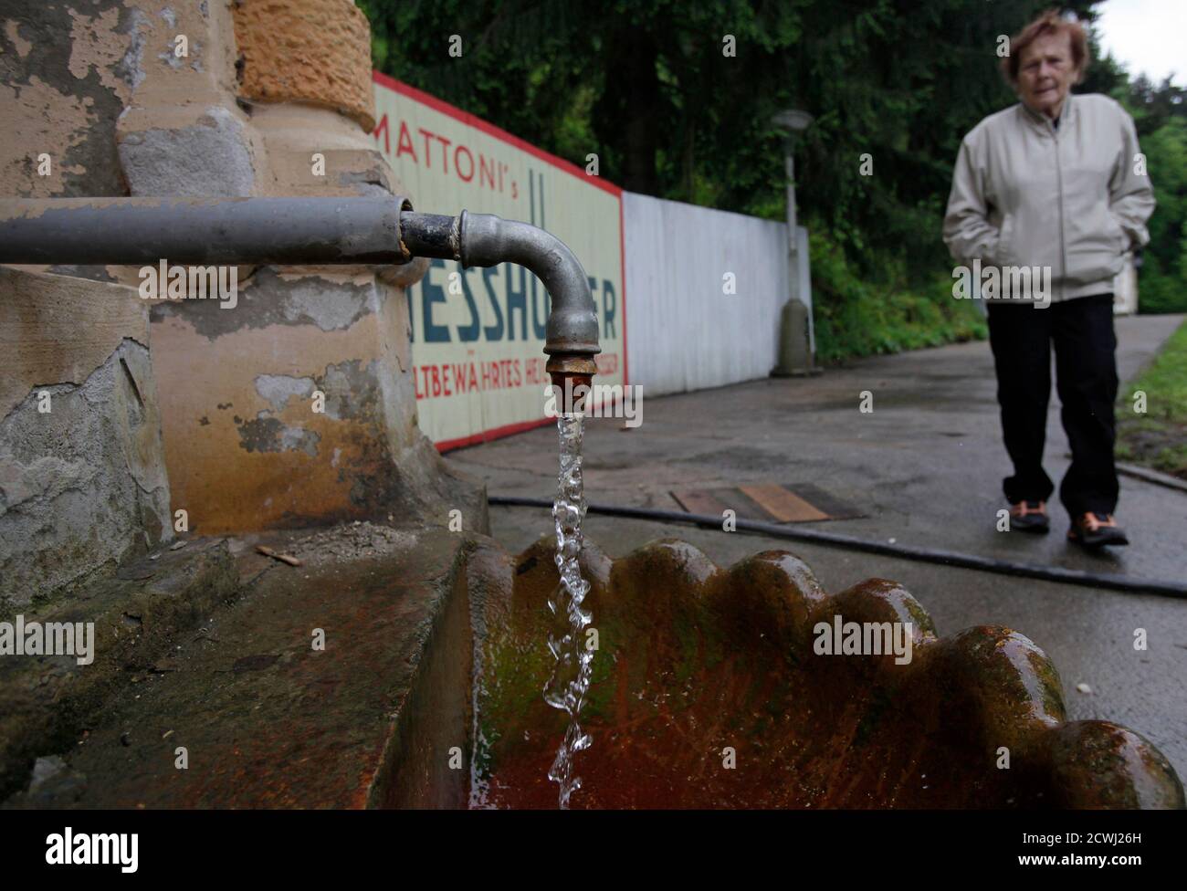 A woman walks past Otto's spring inside the former Spa Kyselka, near Karlovy Vary May 18, 2013. The spa, which was formerly used as public baths, was temporarily closed down after the fall of the Communist regime in 1989. Since 1989, the cultural monument has had several owners who failed to restore it. The spa is now standing on the verge of complete devastation. REUTERS/David W Cerny (CZECH REPUBLIC - Tags: SOCIETY TRAVEL) Stock Photo