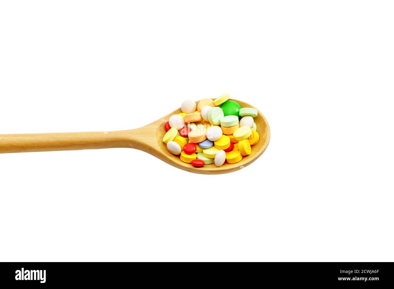 Many types of medications are on the wooden spoon Stock Photo - Alamy