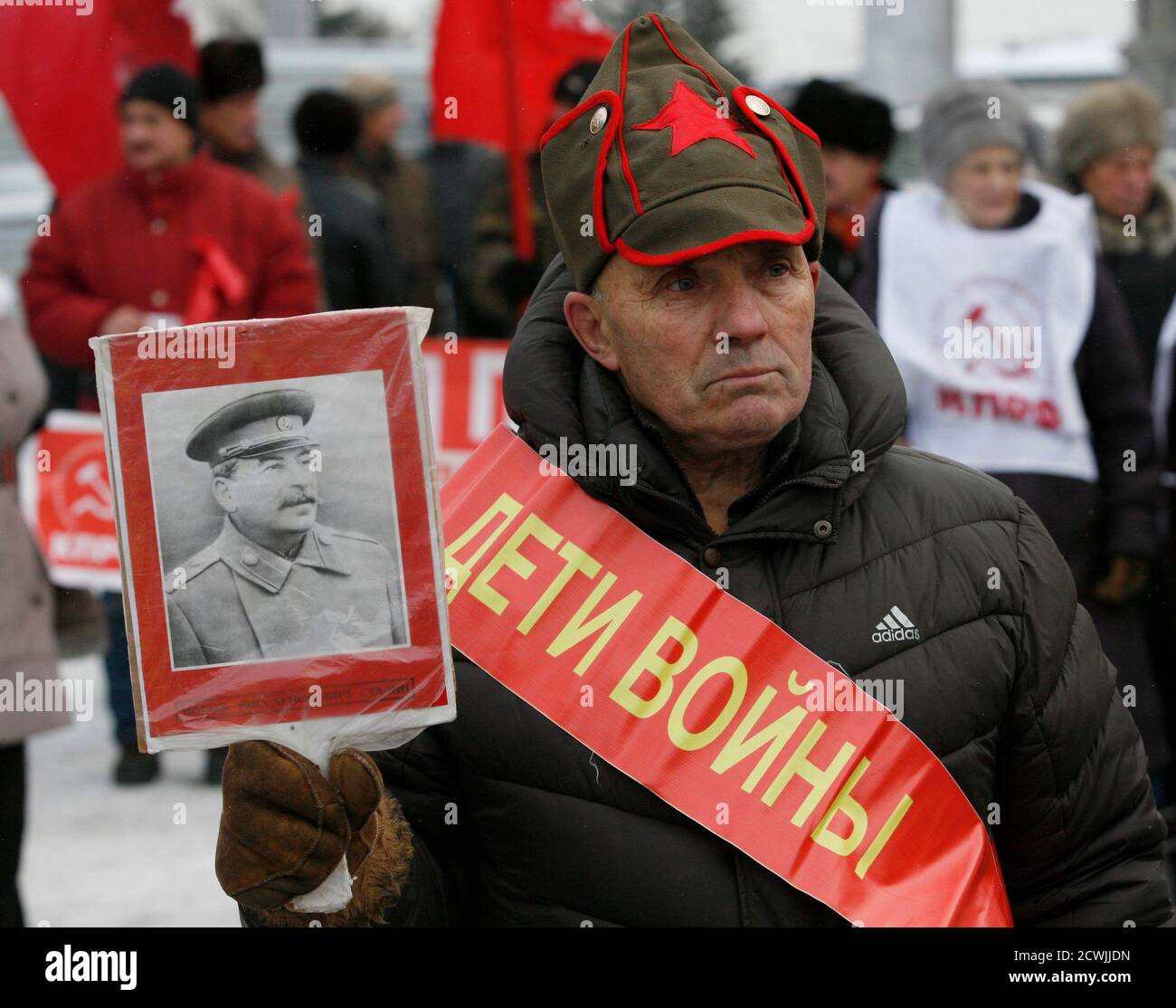 A Communist supporter holds an image of Soviet leader Josef Stalin during a  rally in the centre of Russia's Siberian city of Krasnoyarsk, November 7,  2013. Communist supporters in Russia commemorate the