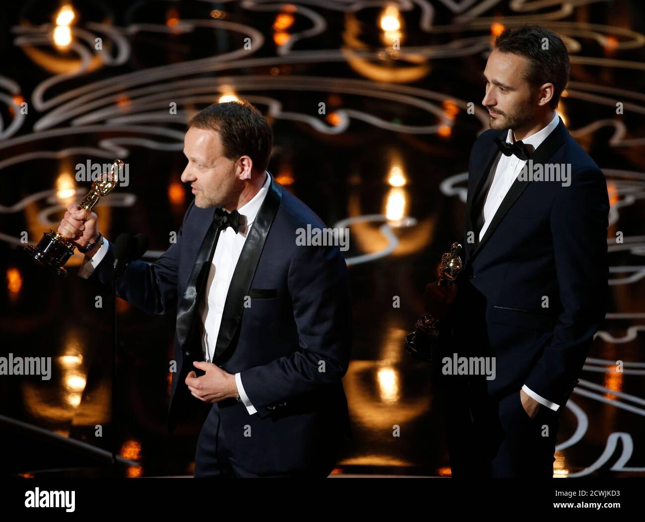 Kim Magnusson (L) and Anders Walter accept the Oscar for best live action short  film for "Helium" at the 86th Academy Awards in Hollywood, California March  2, 2014. REUTERS/Lucy Nicholson (UNITED STATES -