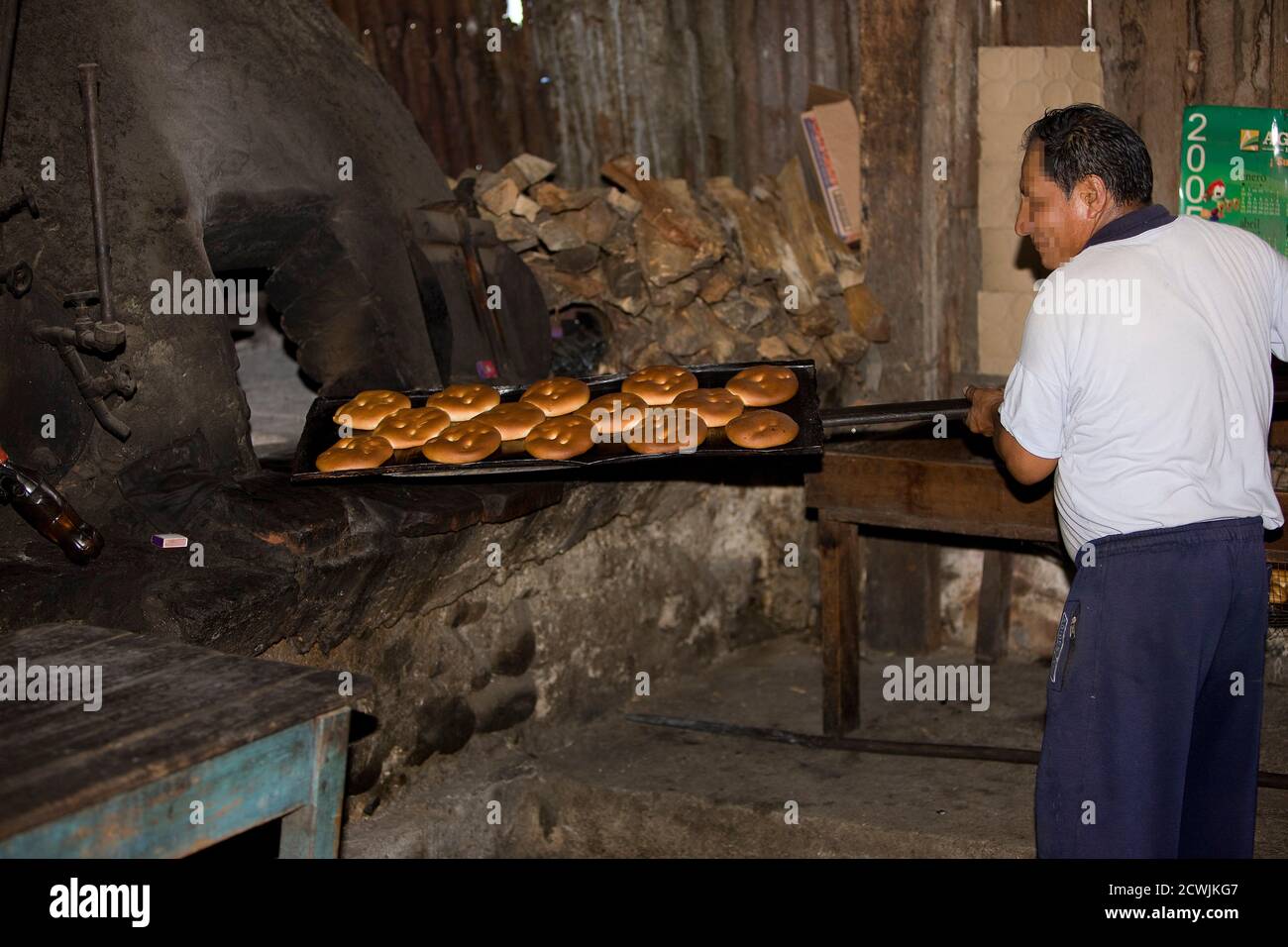 Baker working in Basic Bakery, Pilcopata Village in Peru Stock Photo
