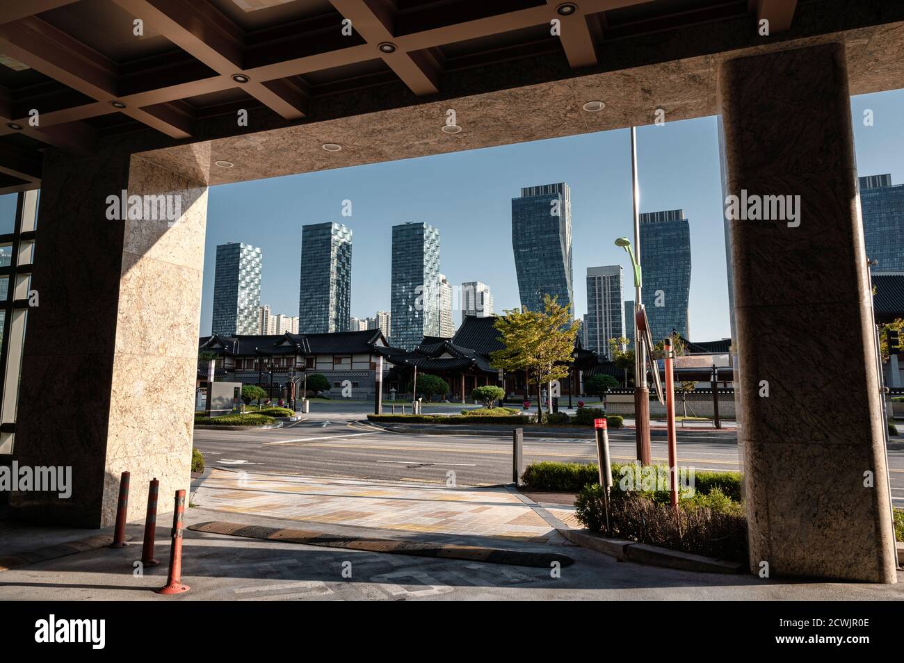 Modern skyscraper in Songdo Central Park with Ancient traditional hotel ...