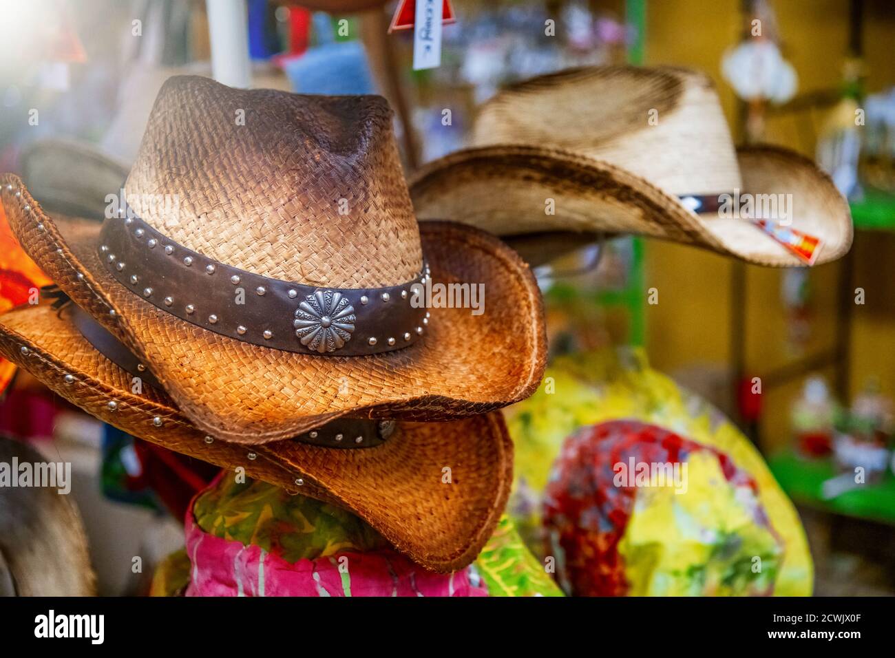 Rack of straw cowboy hats in a texan shop Stock Photo Alamy