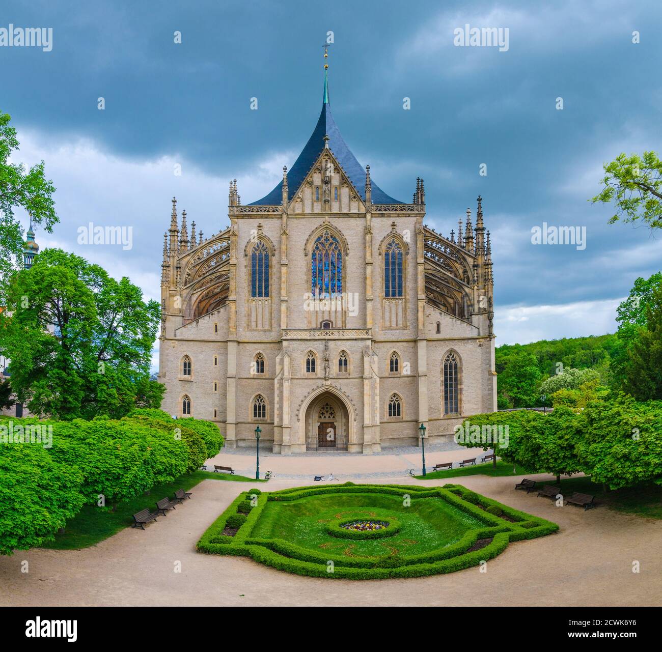 Saint Barbara's Church Cathedral of St Barbara Roman Catholic church Gothic style building facade, flowerbed with bushes in Kutna Hora historical Town Centre, Central Bohemian Region, Czech Republic Stock Photo