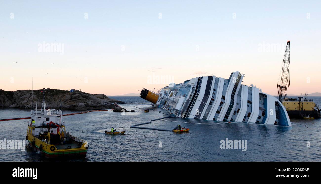 An Oil Recovery Sea Platform R Is Seen Next To The Costa Concordia Cruise Ship Off The West Coast Of Italy At Giglio Island January 25 2012 The Captain Of The Italian